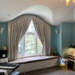 Eyebrow window operable drapery treatments